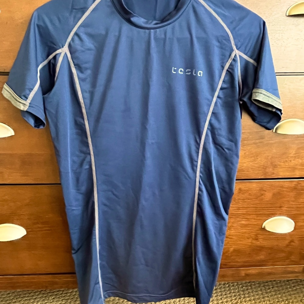 Men’s navy polyester short sleeve athletic pullover shirt.